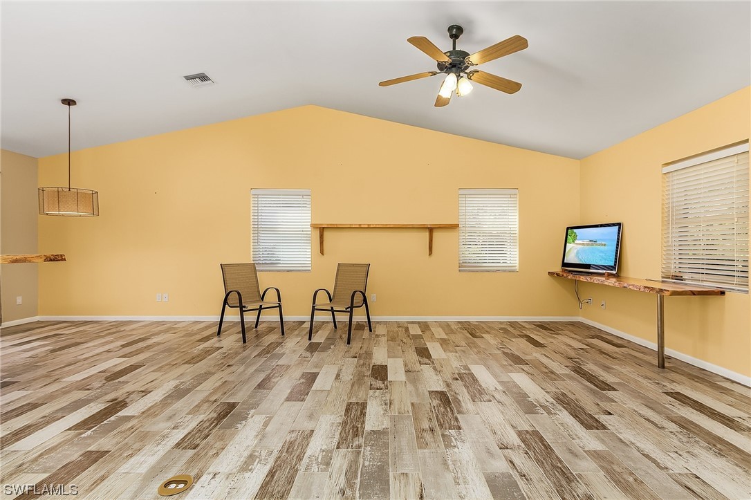 13673 Hampton Road Bokeelia, FL 33922 - Photo 7 of 28 a bedroom with a bed and a table in it