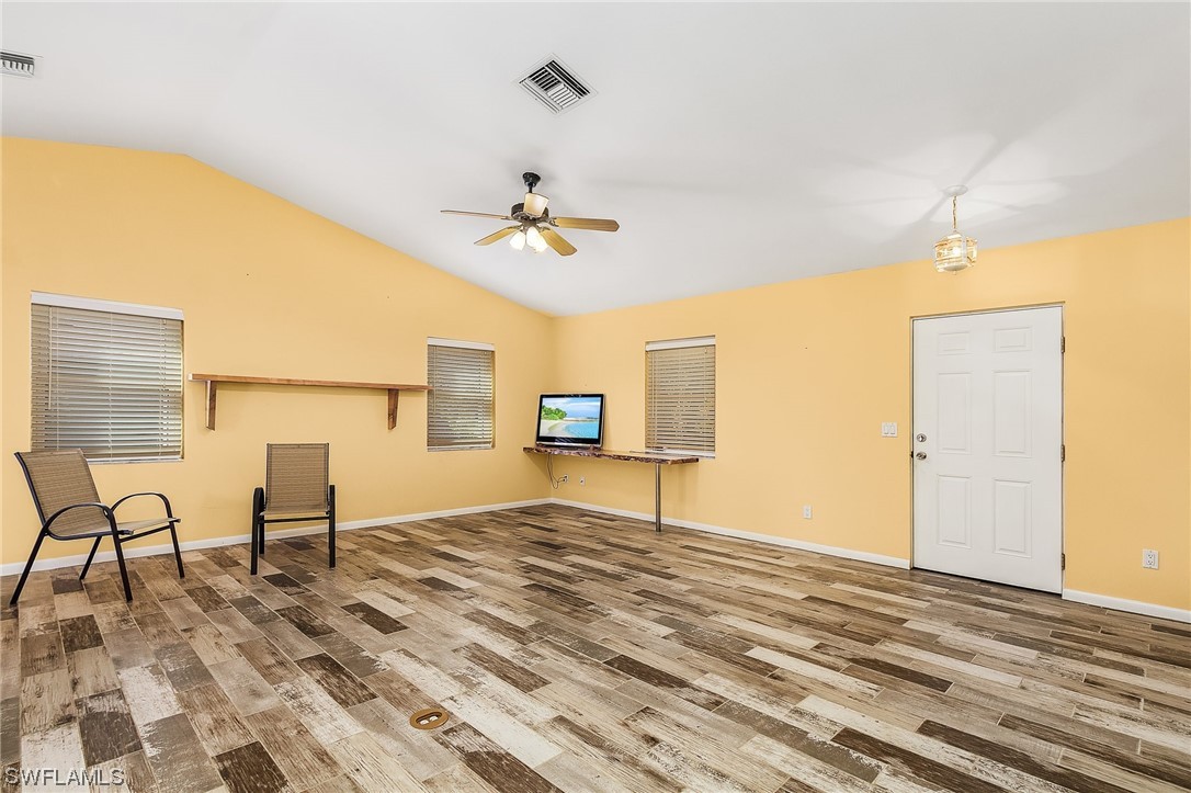 13673 Hampton Road Bokeelia, FL 33922 - Photo 8 of 28 a view of a livingroom with furniture and a ceiling fan