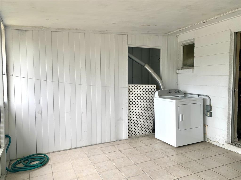 12629 1st Isle Hudson, FL 34667 - Photo 16 of 29 a utility room with dryer and washer