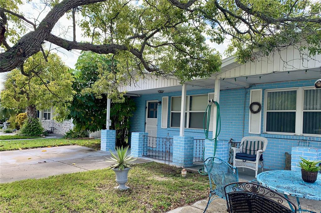 12629 1st Isle Hudson, FL 34667 - Photo 3 of 29 a front view of a house with garden