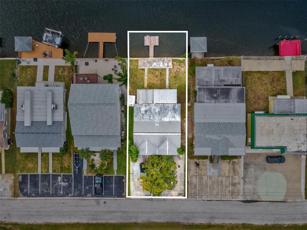 12629 1st Isle Hudson, FL 34667 - Photo 7 of 29 an aerial view of residential houses with outdoor space and parking