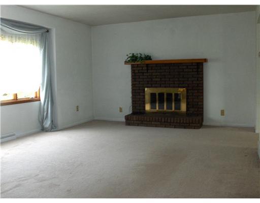 381 Raymaley Road Irwin, PA 15642 - Photo 5 of 18 Living Room. THE LARGE LIVING ROOM WITH WOOD-BURNING BRICK FIREPLACE AND NEUTRAL CARPET IS LOCATED JUST OFF OF THE KITCHEN AND DINING ROOM.