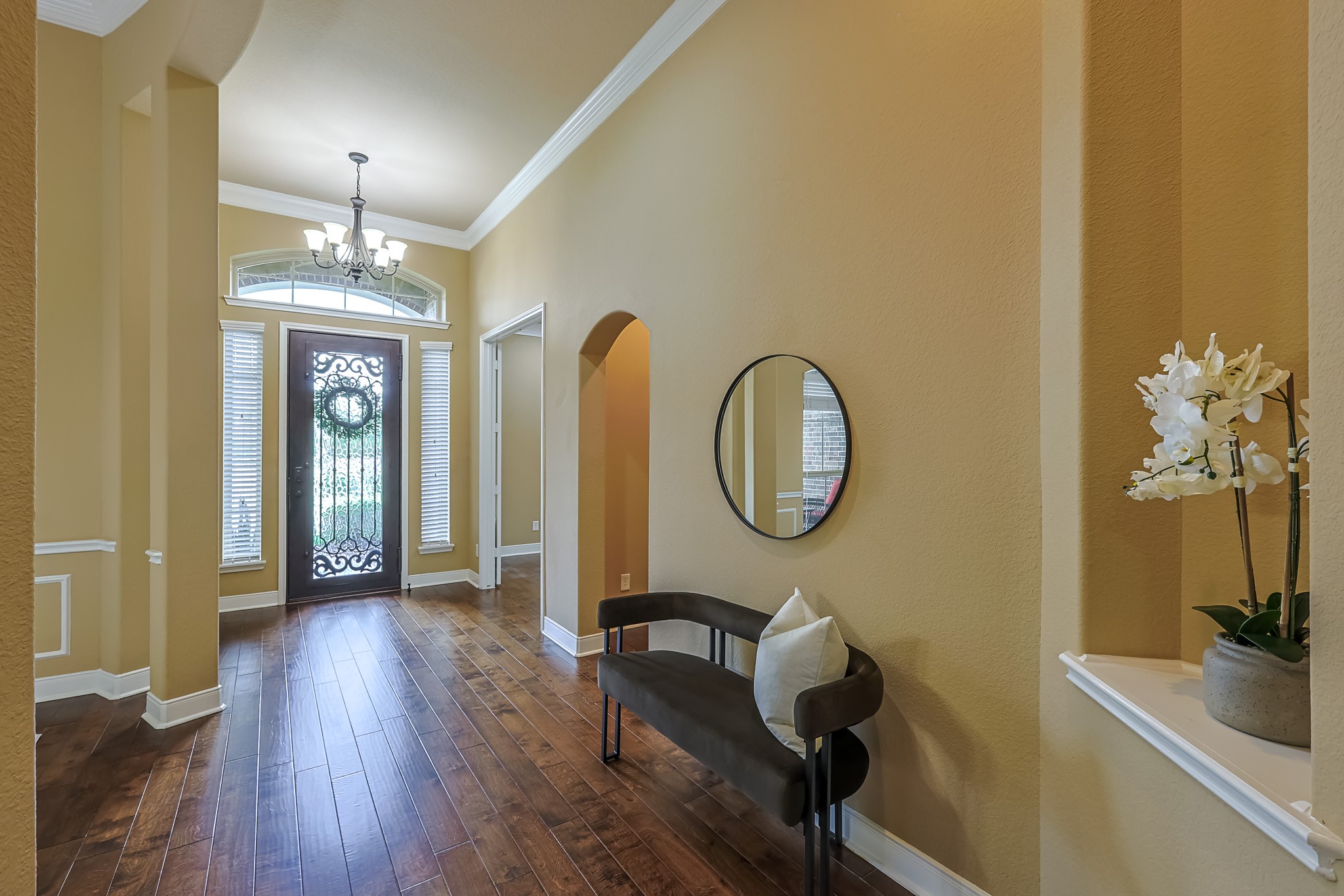 515 Mill Creek Road Pinehurst, TX 77362 - Photo 3 of 48 Bright entryway with warm beige walls, hardwood floors, and a decorative front door with sidelights.