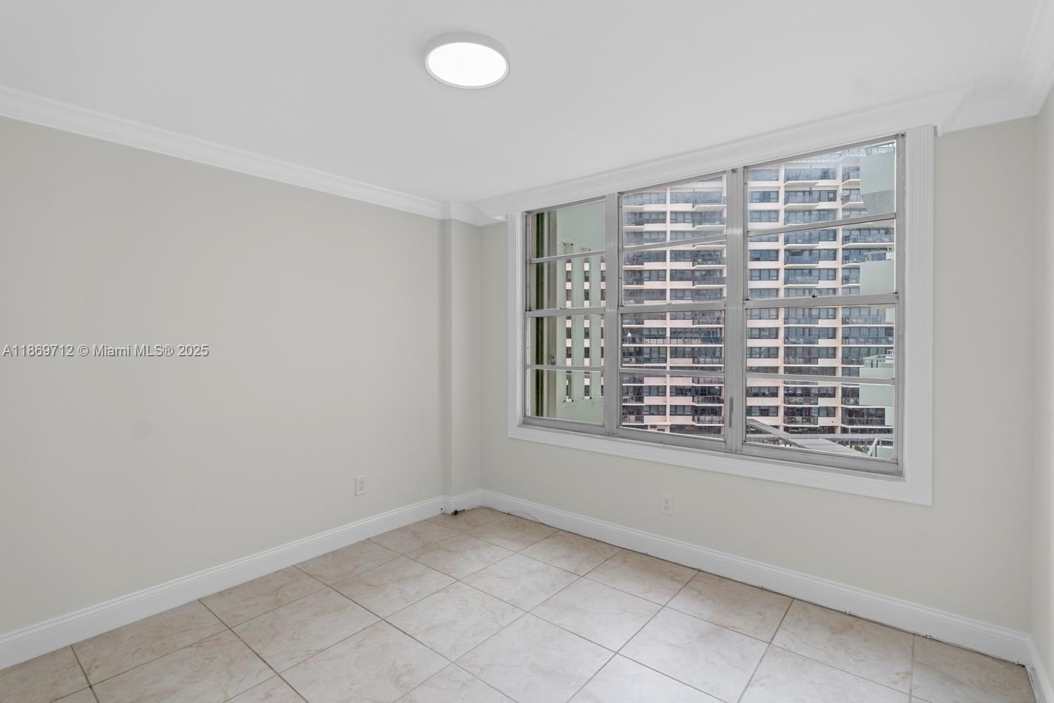 5161 Collins Avenue, Unit 701 Miami Beach, FL 33140 - Photo 18 of 47 a view of an empty room with a window