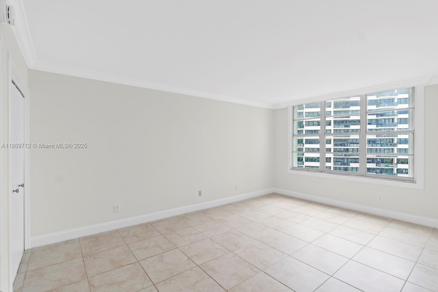 5161 Collins Avenue, Unit 701 Miami Beach, FL 33140 - Photo 20 of 47 a view of an empty room with a window