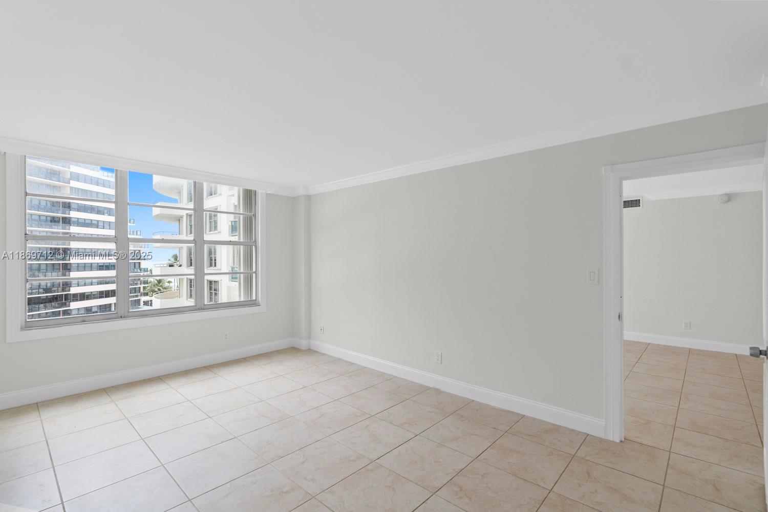 5161 Collins Avenue, Unit 701 Miami Beach, FL 33140 - Photo 21 of 47 a view of an empty room with a window