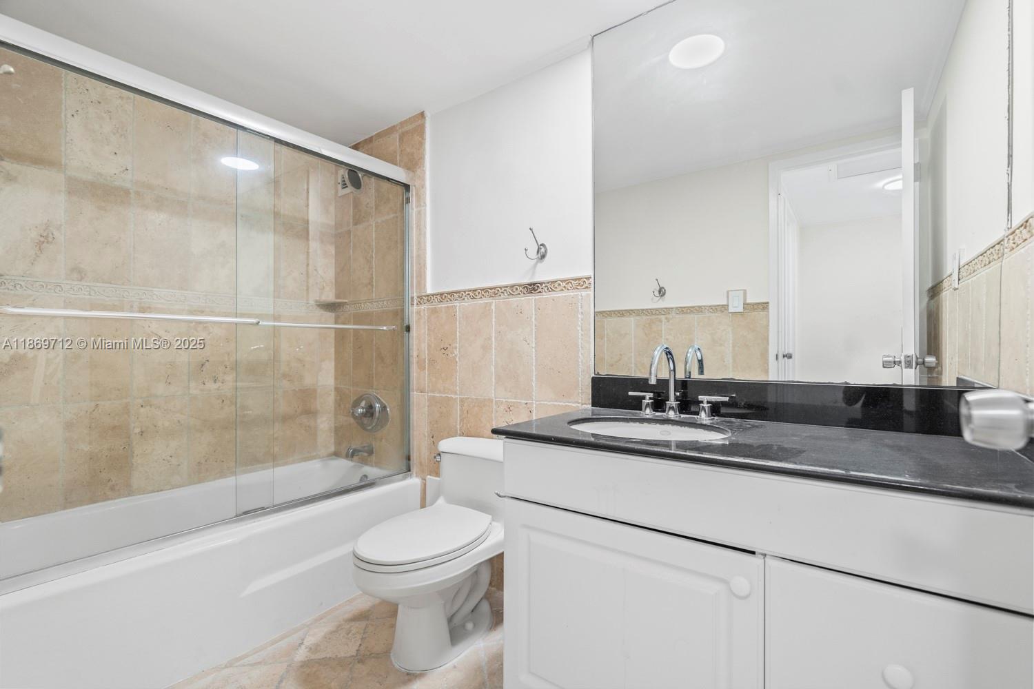 5161 Collins Avenue, Unit 701 Miami Beach, FL 33140 - Photo 27 of 47 a bathroom with a sink a toilet and a bathtub