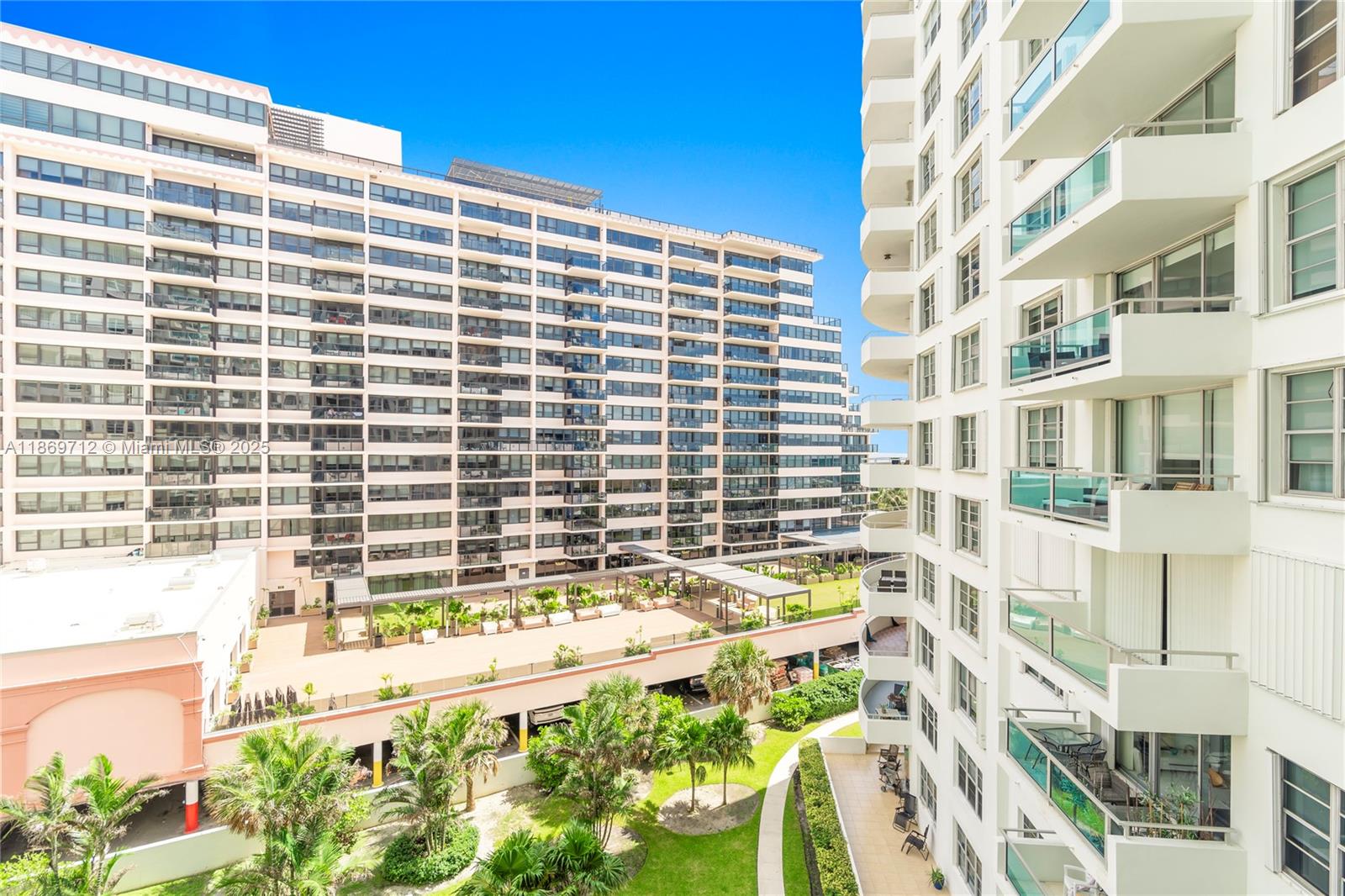 5161 Collins Avenue, Unit 701 Miami Beach, FL 33140 - Photo 33 of 47 a front view of a building with a lot of windows