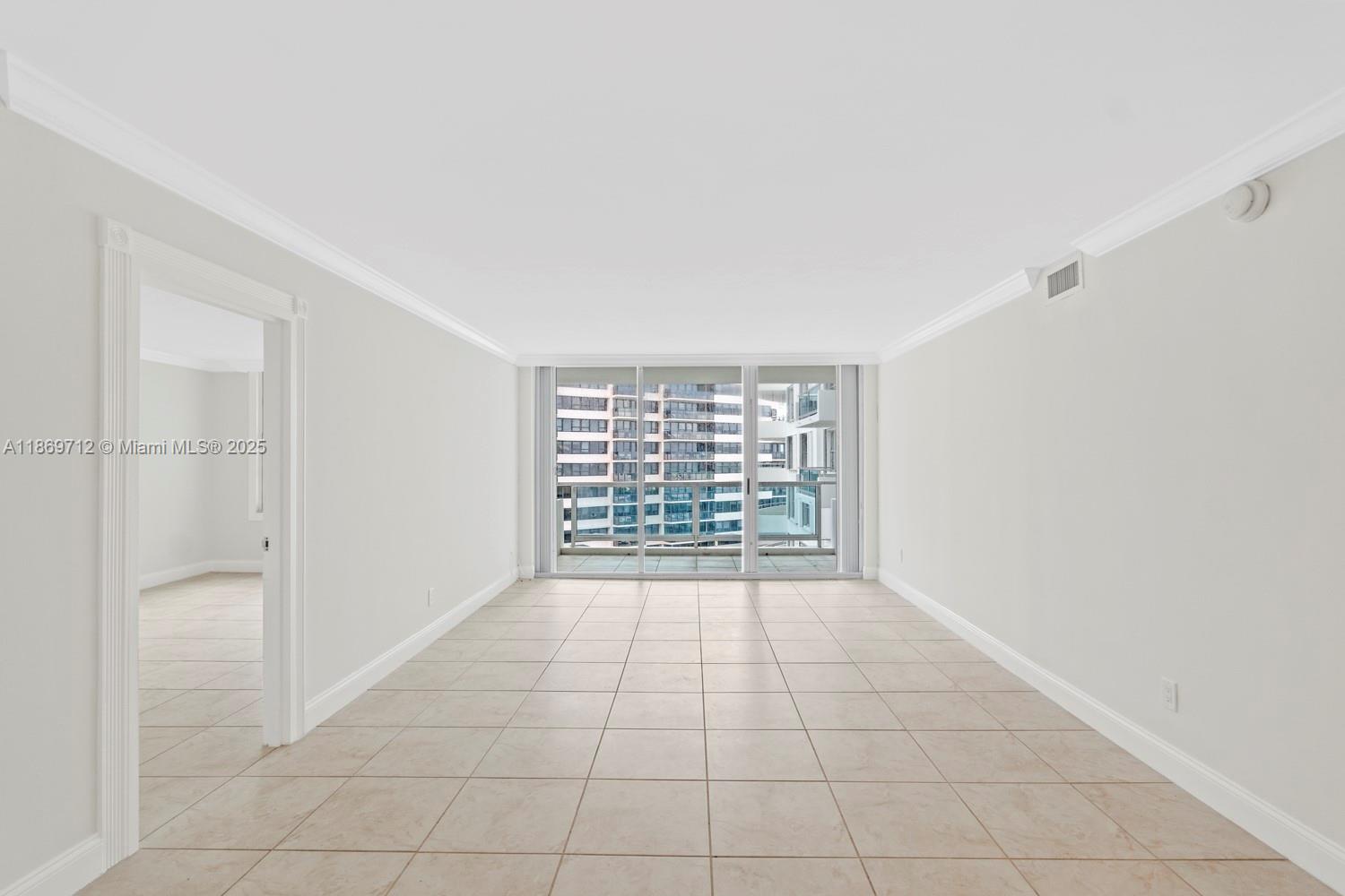 5161 Collins Avenue, Unit 701 Miami Beach, FL 33140 - Photo 5 of 47 a view of an empty room with a window