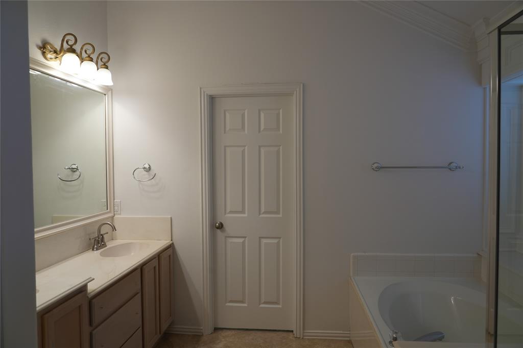 6437 Landmark Trail The Colony, TX 75056 - Photo 14 of 17 a bathroom with a granite countertop sink toilet and shower