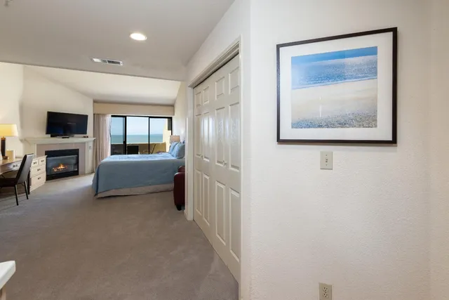 a bedroom with a bed and a couch