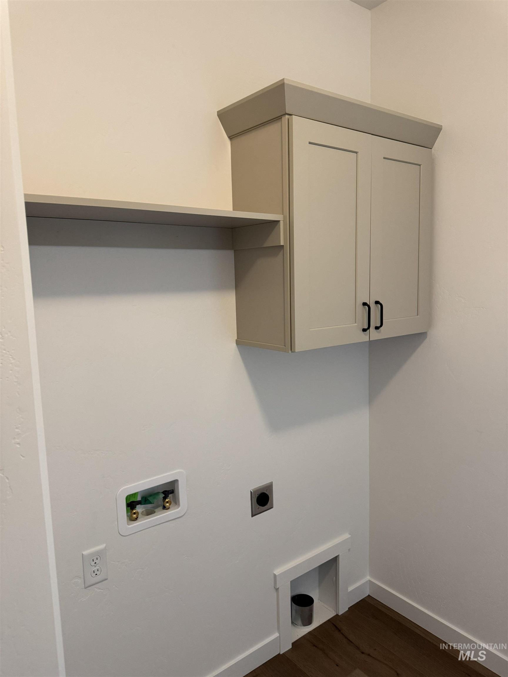 1295 Starlight Loop Twin Falls, ID 83301 - Photo 11 of 11 Laundry area featuring dark wood-style floors, cabinet space, hookup for a washing machine, and hookup for an electric dryer