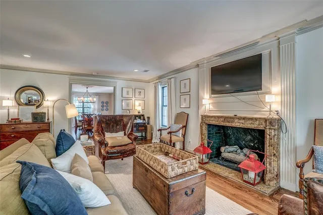 a living room with furniture fireplace and flat screen tv