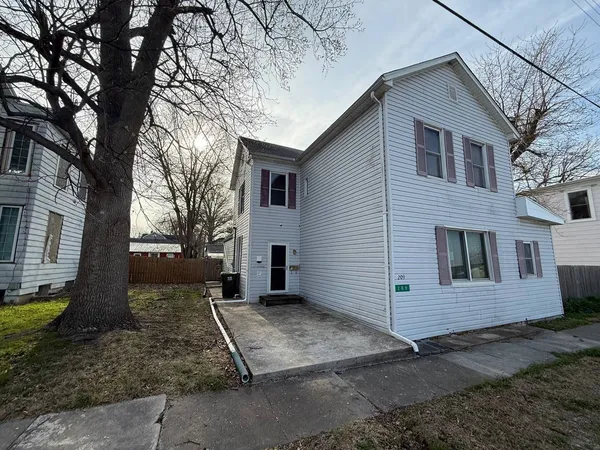 a view of a house with a yard