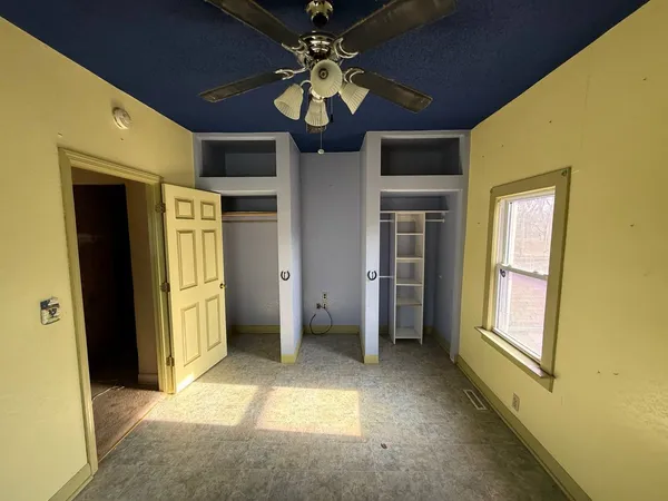 a view of livingroom with chandelier fan