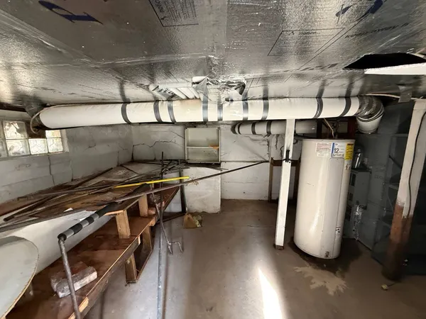 a view of a chairs and table in backyard of the house