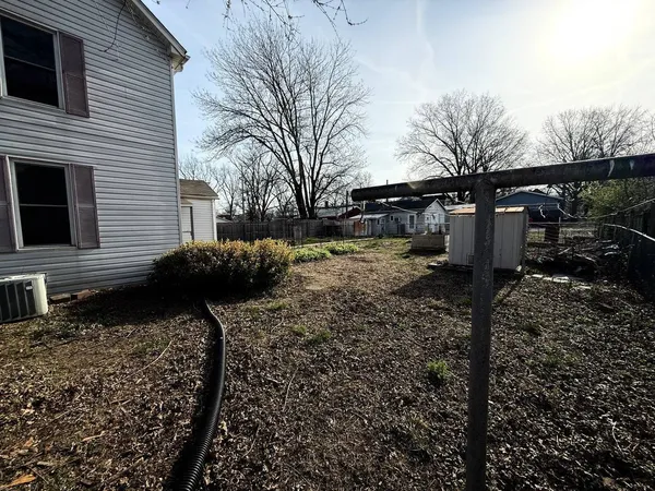 a large house with a large tree in front of it