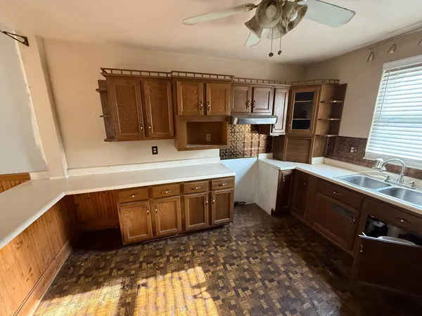 a spacious bathroom with a sink double vanity granite and a mirror