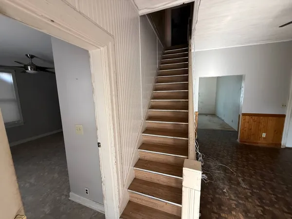 a view of entryway with wooden floor