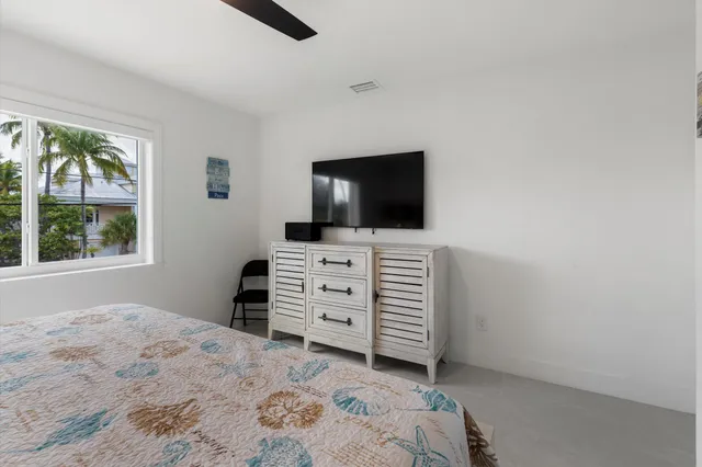 a room with furniture and flat screen tv