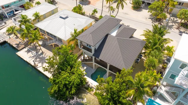 a view of a lake with a house in the background