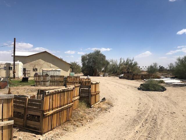 25650 Kaiser Road Desert Center, CA 92239 - Photo 22 of 44 a view of a house with wooden fence