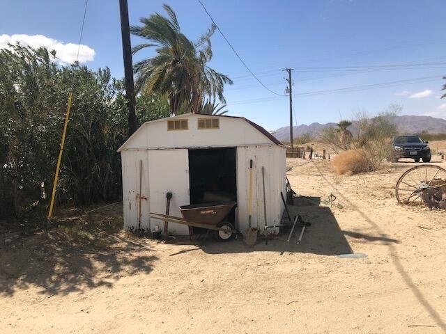 25650 Kaiser Road Desert Center, CA 92239 - Photo 33 of 44 a front view of a house with a yard