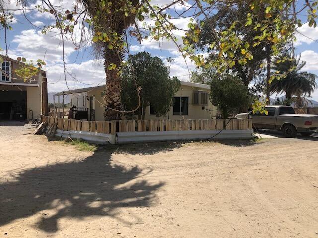 25650 Kaiser Road Desert Center, CA 92239 - Photo 34 of 44 a backyard of a house with table and chairs