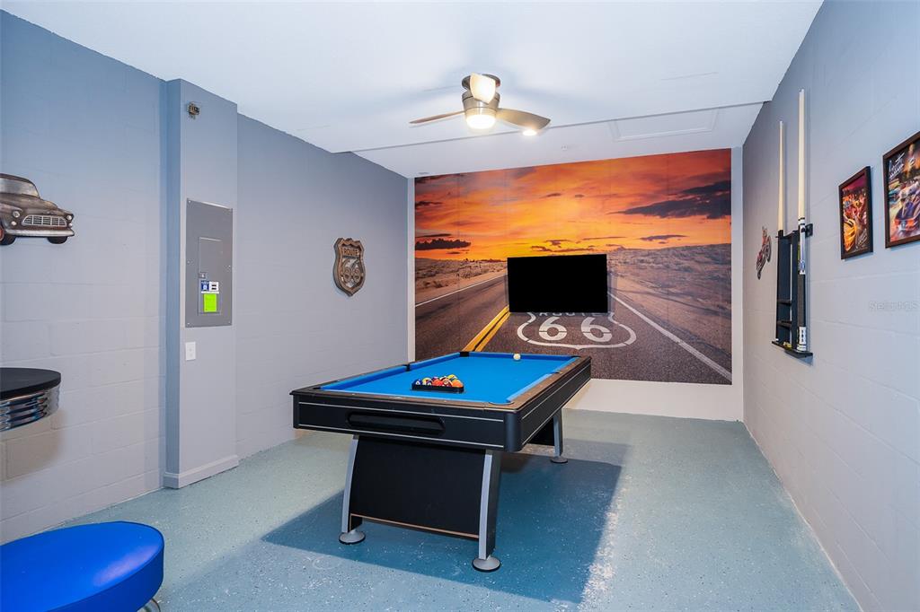 817 Ocean Course Avenue Davenport, FL 33896 - Photo 6 of 32 a living room with furniture and a flat screen tv