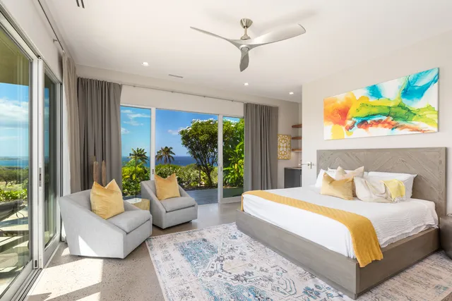 a bathroom with a granite countertop sink and a large mirror