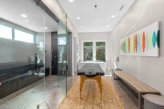 a bath tub sitting in a bathroom next to a window