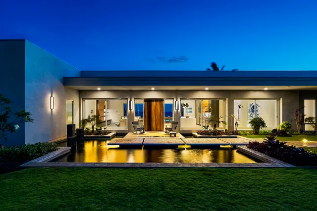 a view of a swimming pool with outdoor seating