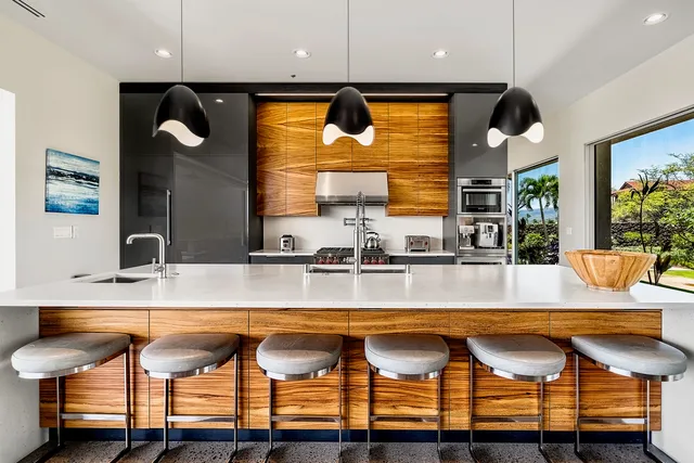 a kitchen with a table chairs sink and window