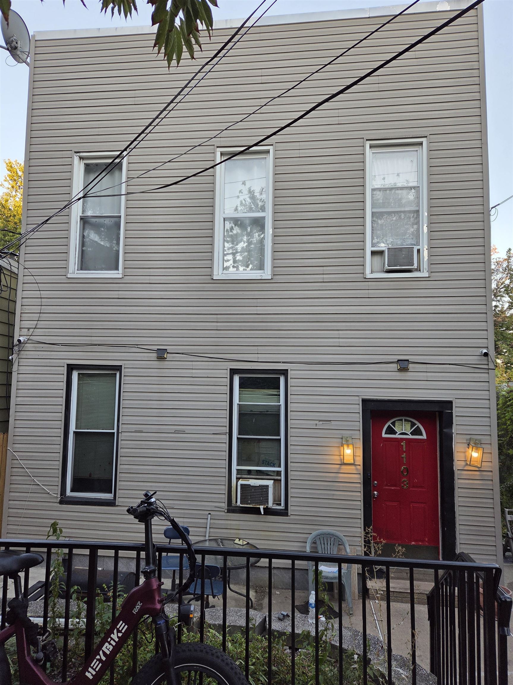 a view of a brick house with a large windows