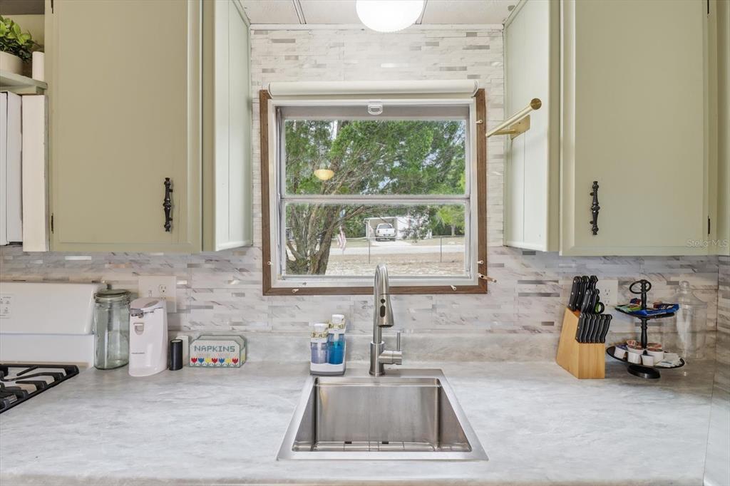 7749 West Chassahowitzka Street Homosassa, FL 34446 - Photo 14 of 30 a kitchen with a sink and a window