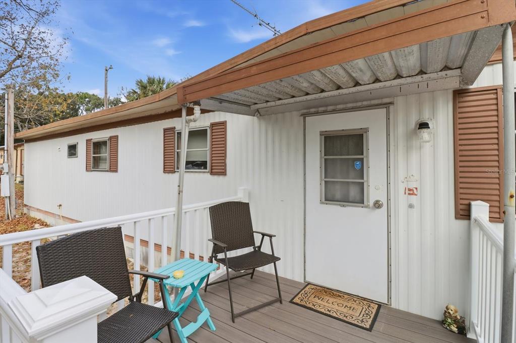 7749 West Chassahowitzka Street Homosassa, FL 34446 - Photo 6 of 30 a patio with table and chairs