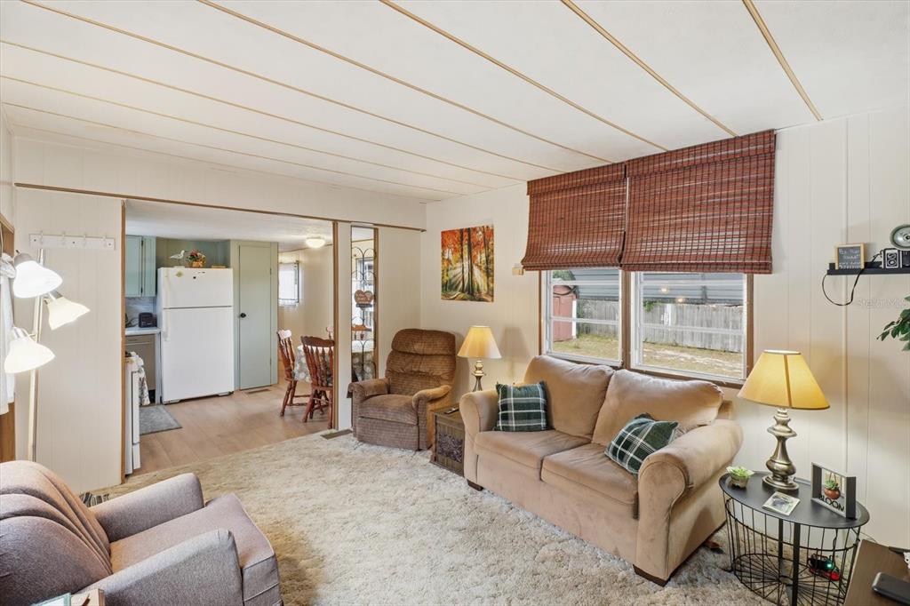 7749 West Chassahowitzka Street Homosassa, FL 34446 - Photo 9 of 30 a living room with furniture and a large window