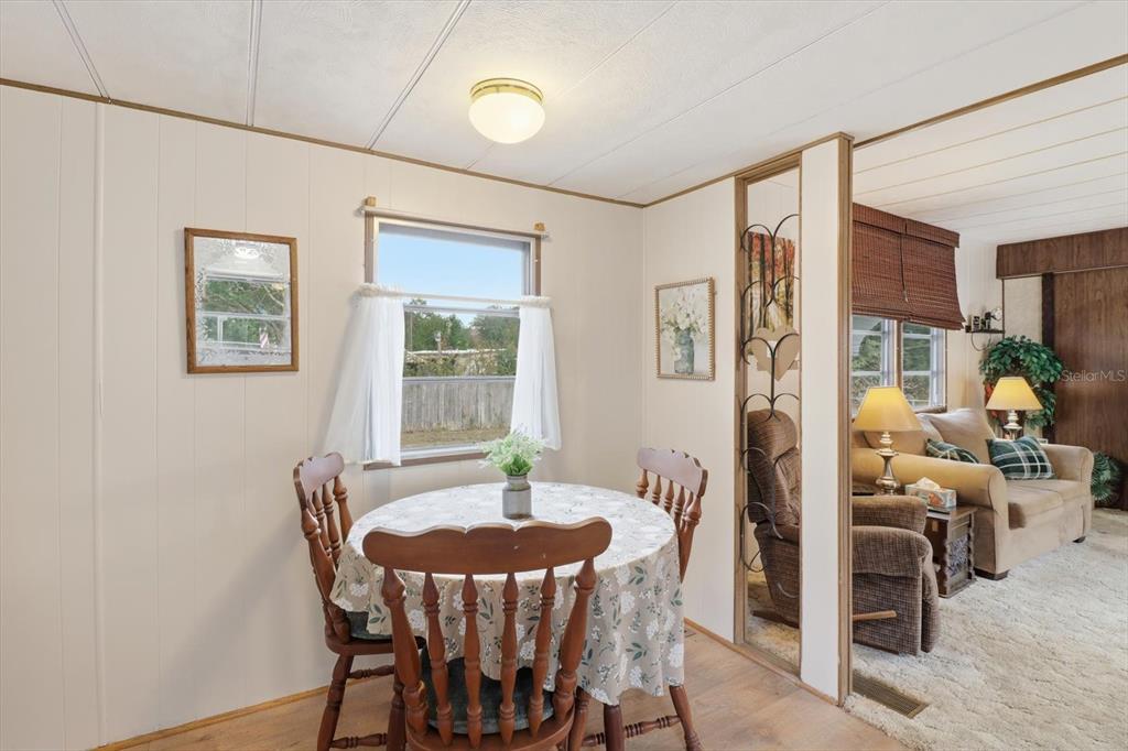 7749 West Chassahowitzka Street Homosassa, FL 34446 - Photo 10 of 30 a view of a dining room with furniture and window