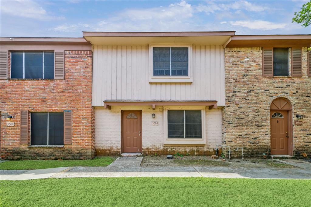 3003 Falk Court, Unit 3003 La Porte, TX 77571 - Photo 1 of 13 front view of a brick house with a yard