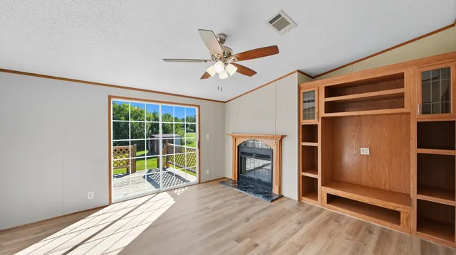 a view of workspace with furniture and a window