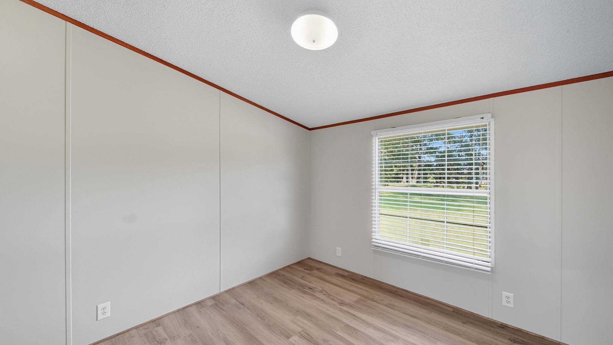 835 Robertson Road Mason, TN 38049 - Photo 17 of 22 a view of an empty room with a window