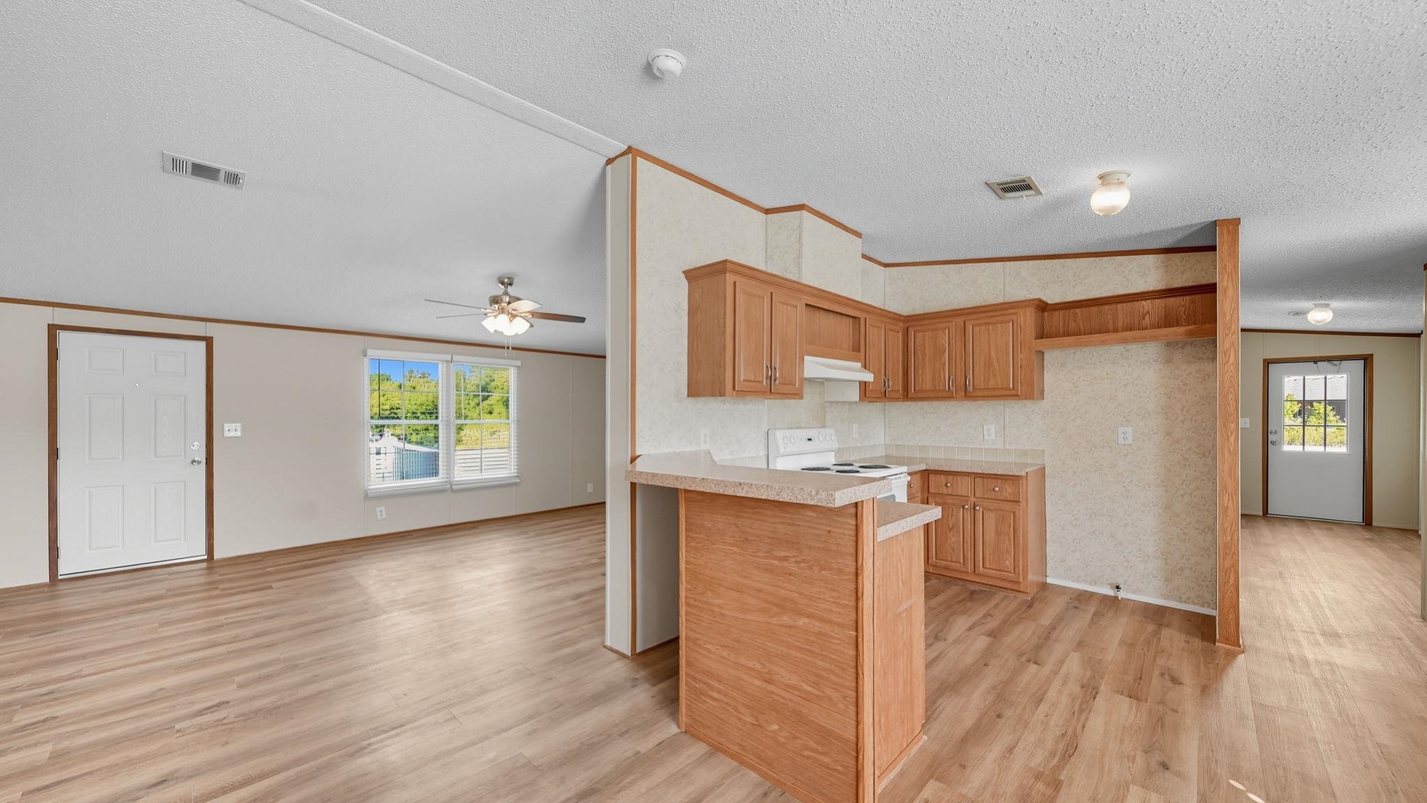 835 Robertson Road Mason, TN 38049 - Photo 8 of 22 a view of a kitchen cabinets and wooden floor
