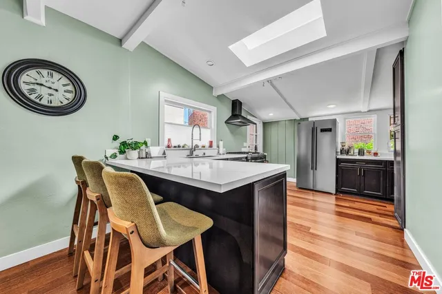 a kitchen with a table and chairs