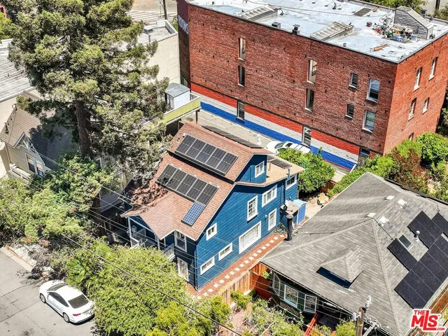 an aerial view of a building with garden