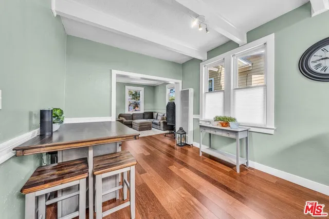 a room with furniture a rug and a window