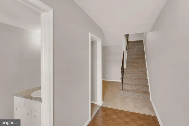 a view of a hallway with stairs