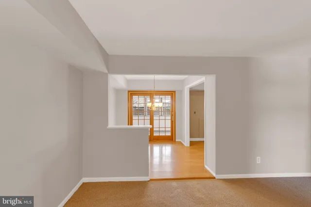 a view of hallway with wooden floor