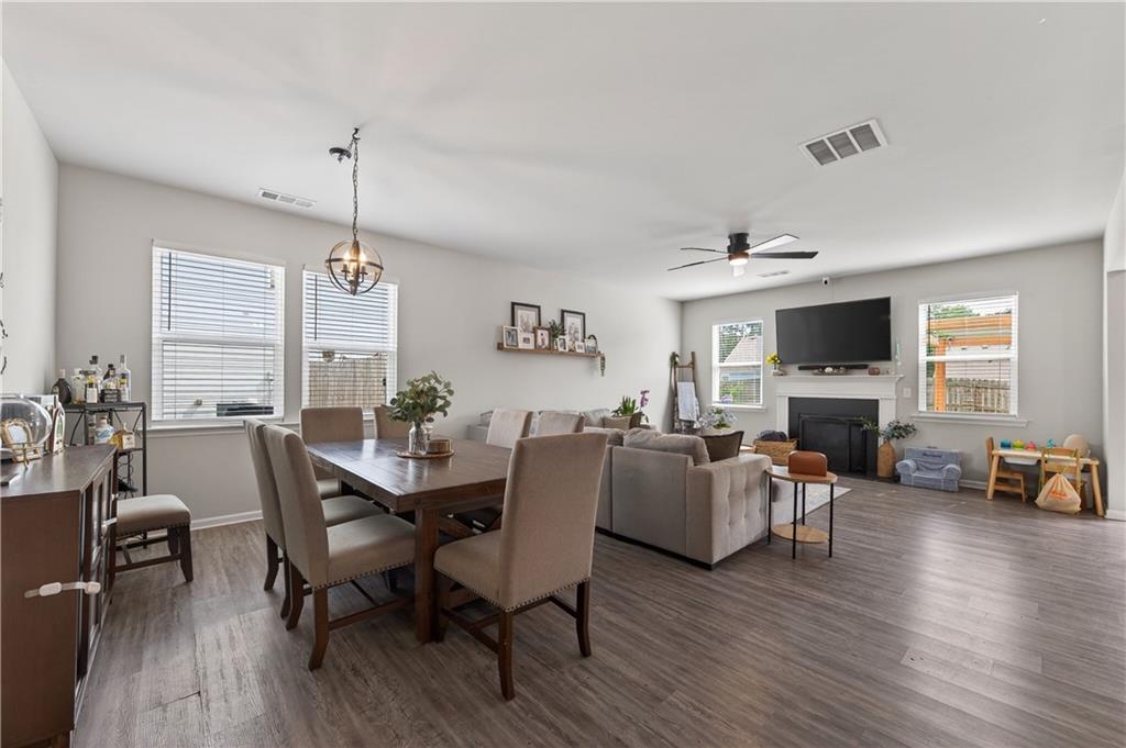 266 Shoals Bridge Road Acworth, GA 30102 - Photo 10 of 43 a view of a dining room with furniture window and wooden floor