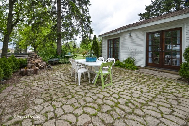 3S559 Norris Road Sugar Grove, IL 60554 - Photo 21 of 30 a outdoor space with a large window and chairs