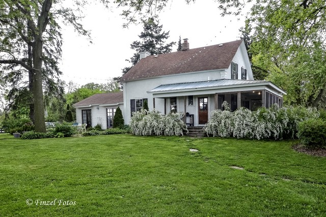 3S559 Norris Road Sugar Grove, IL 60554 - Photo 7 of 30 a front view of a house with a garden